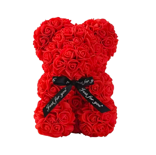 Red rose teddy bear with a black ribbon on a white background