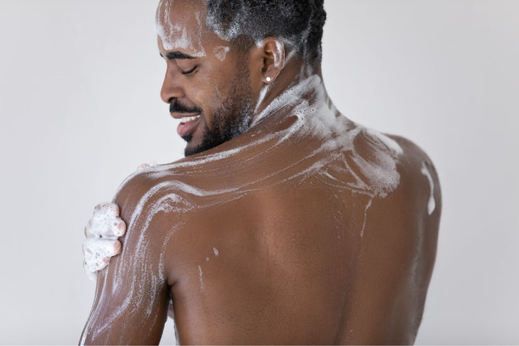 Man washing body.