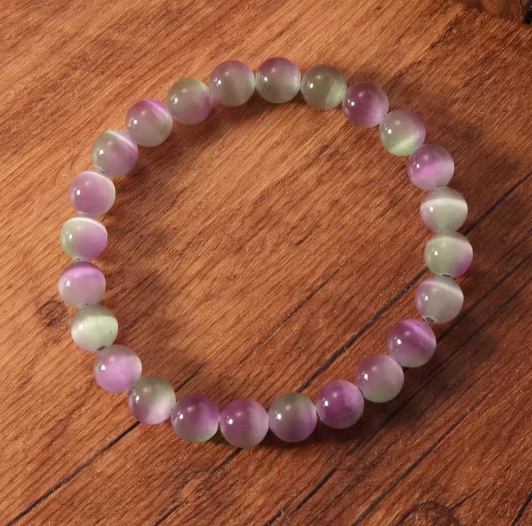 Multicolored beaded bracelet on a wooden surface