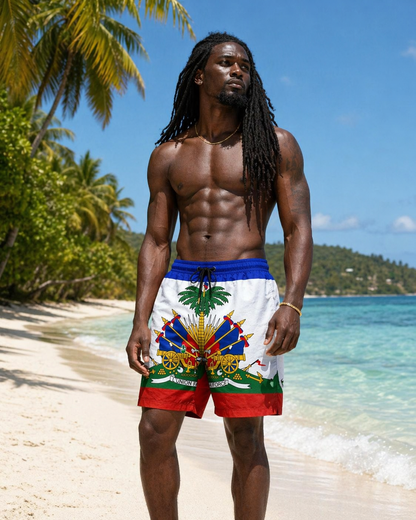 Man wearing colorful Haiti beach shorts with a tropical design on a beach.