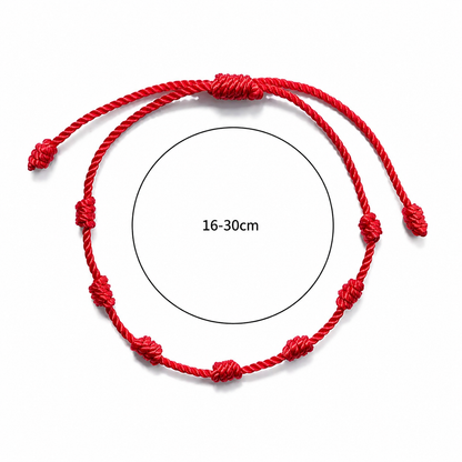 Red string bracelet with measurement range 16-30cm on a white background