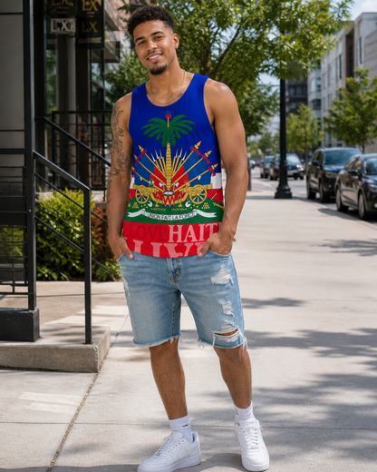 Light skin Haitian man wearing a blue Haiti flag tank top, ripped denim shorts, and white sneakers while standing on an American city sidewalk.